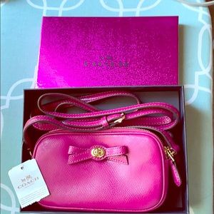 Coach cranberry shoulder pouch.